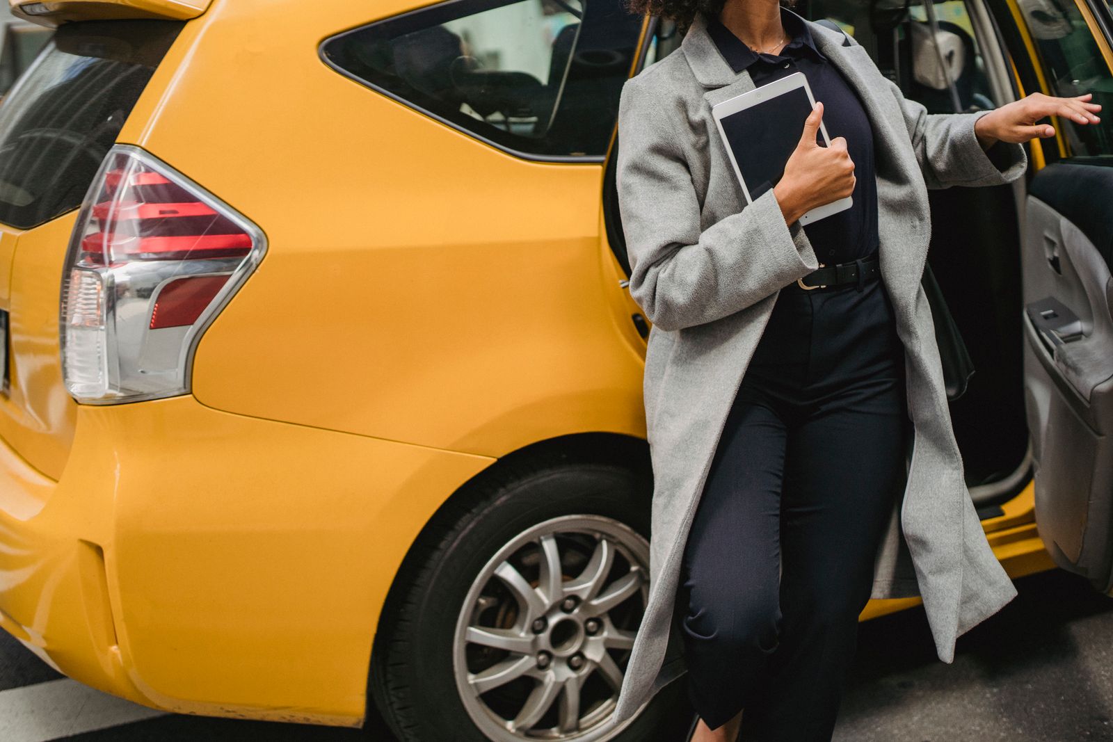 Business travelers walking to a car